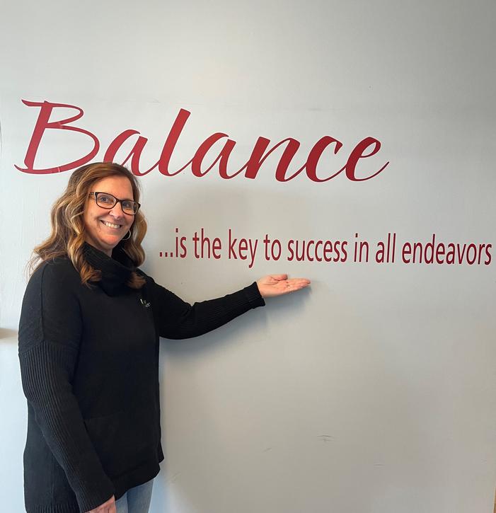 Ann Tosovsky, President, with our 2022 word of the year Ann Tosovsky, President, with our 2022 word of the year